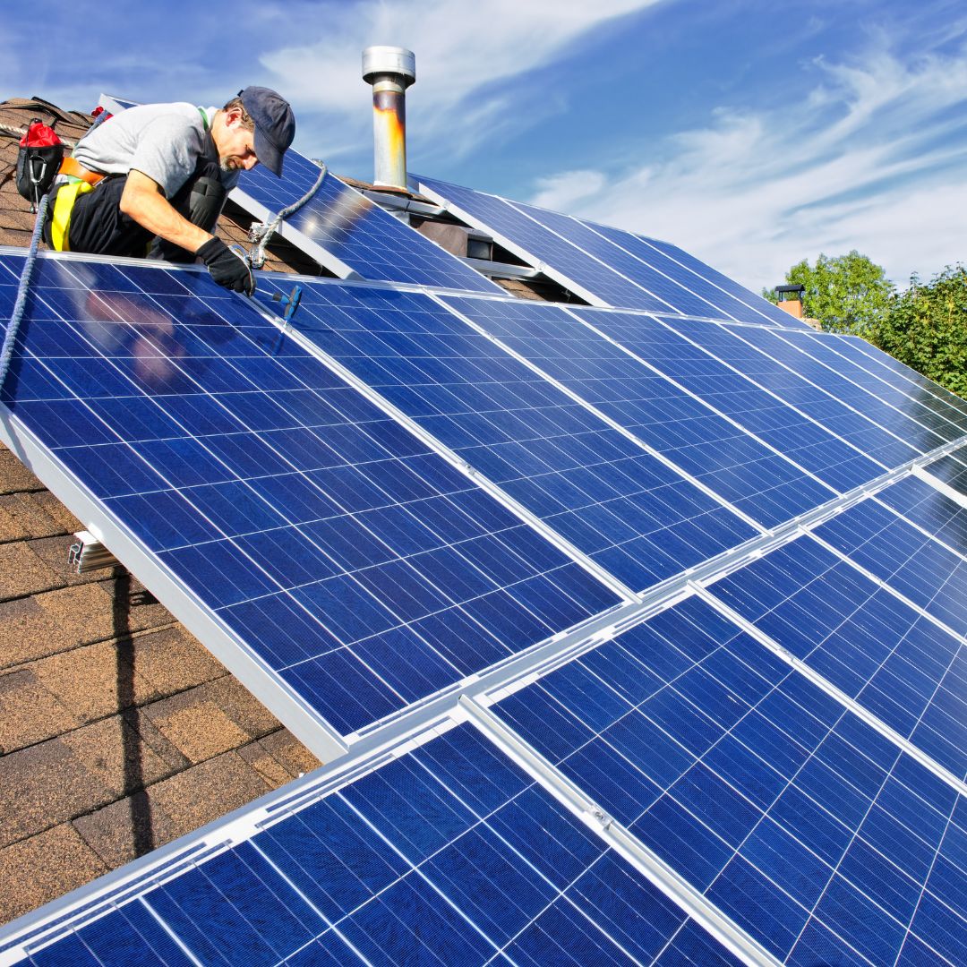 technician working on residential solar panels