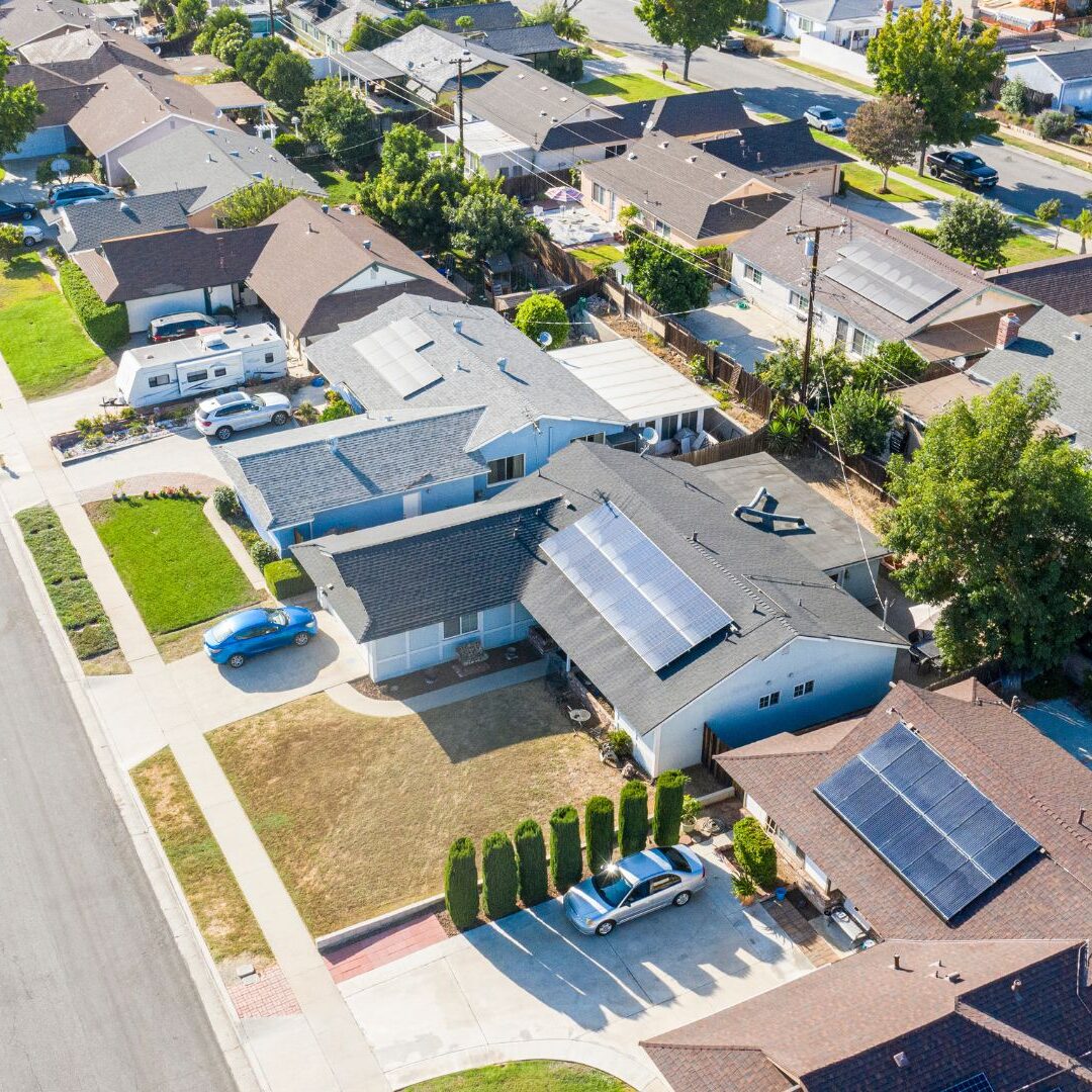 neighborhood with solar panels on homes