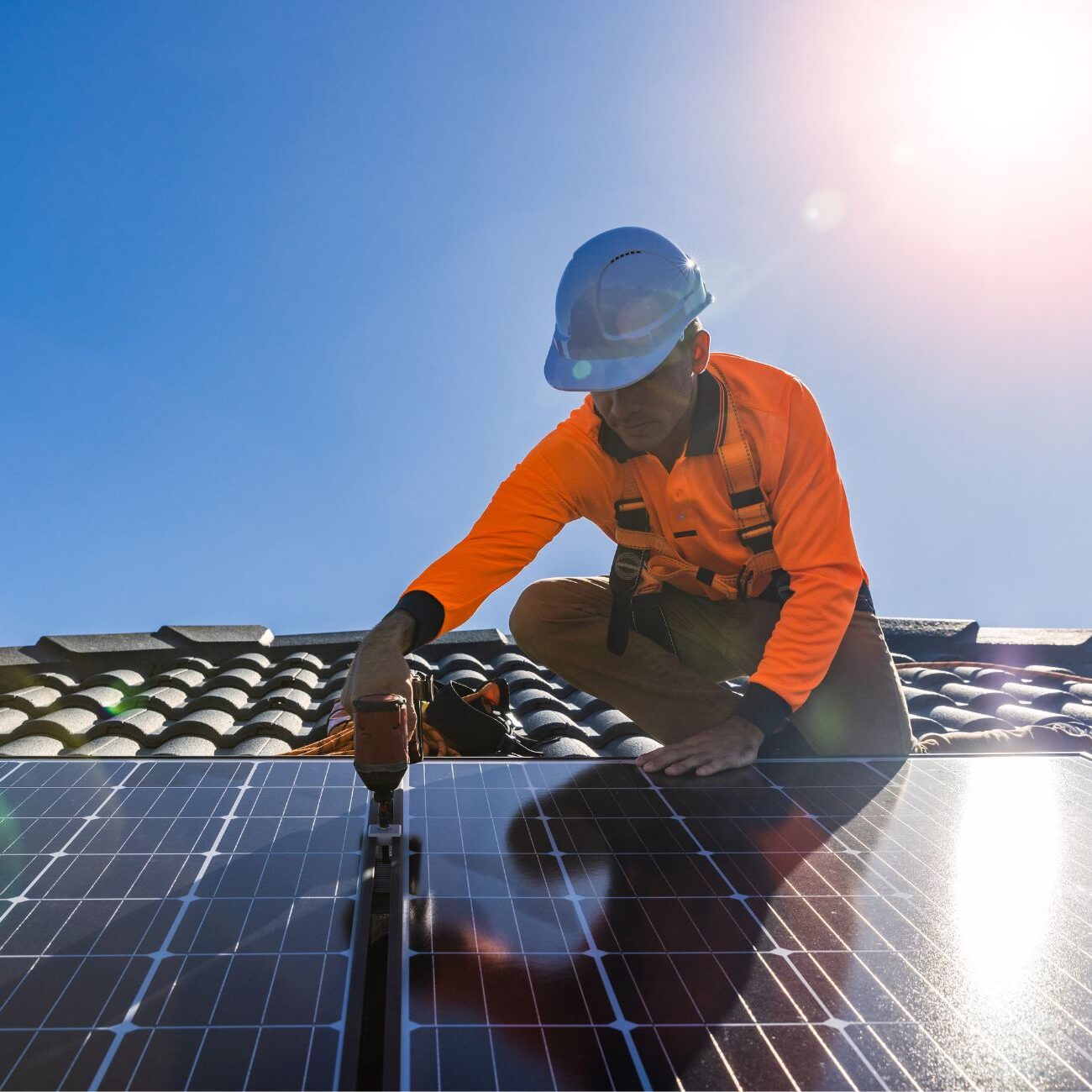 technician installing solar panel